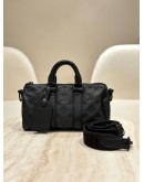 LOUIS VUITTON KEEPALL BANDOULIÈRE 25 IN BLACK MONOGRAM TAURILLON LEATHER