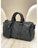 LOUIS VUITTON KEEPALL BANDOULIÈRE 25 IN BLACK MONOGRAM TAURILLON LEATHER