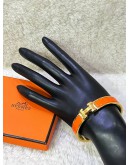 HERMES CLIC CLAC H BANGLE IN CLASSIC ORANGE WITH GOLD PLATED HARDWARE