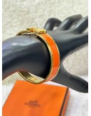 HERMES CLIC CLAC H BANGLE IN CLASSIC ORANGE WITH GOLD PLATED HARDWARE