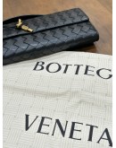 BOTTEGA VENETA ANDIAMO LONG CLUTCH IN BLACK SIGNATURE INTRECCIATO WOVEN LEATHER WITH GOLD HARDWARE 