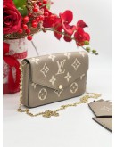 LOUIS VUITTON TOURTERELLE EMPREINTE LEATHER POCHETTE FELICIE IN BEIGE AND WHITE 