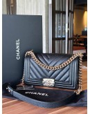 CHANEL MEDIUM CHEVRON BOY IN BLACK CAVIAR LEATHER WITH LIGHT GOLD HARDWARE  