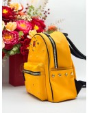MCM BACKPACK IN YELLOW CANVAS & BLACK CALFSKIN LEATHER