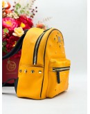 MCM BACKPACK IN YELLOW CANVAS & BLACK CALFSKIN LEATHER