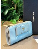 PRADA POWDER BLUE SAFFIANO BOW WALLET  