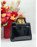 SALVATORE FERRAGAMO TOP HANDLE BAG IN BLACK PATENT LEATHER