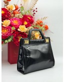 SALVATORE FERRAGAMO TOP HANDLE BAG IN BLACK PATENT LEATHER