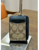 COACH ZIP CARD CASE IN BLOCKED SIGNATURE CANVAS 