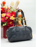 PRADA BAULETTO SHOULDER BAG IN BLACK VITELLO DAINO LEATHER