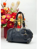 PRADA BAULETTO SHOULDER BAG IN BLACK VITELLO DAINO LEATHER