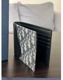CHRISTIAN DIOR SADDLE BI-FOLD WALLET IN BLACK GRAINED CALFSKIN MARQUETRY WITH BEIGE & BLACK DIOR OBLIQUE JACQUARD CANVAS
