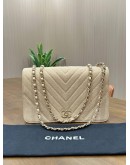 CHANEL STATEMENT FLAP BAG FEATURES IRIDESCENT BEIGE CAVIAR LEATHER CHEVRON QUILTING & LIGHT GOLD HARDWARE 
