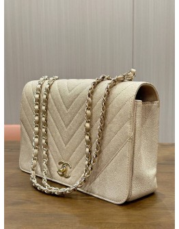 CHANEL STATEMENT FLAP BAG FEATURES IRIDESCENT BEIGE CAVIAR LEATHER CHEVRON QUILTING & LIGHT GOLD HARDWARE 