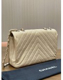 CHANEL STATEMENT FLAP BAG FEATURES IRIDESCENT BEIGE CAVIAR LEATHER CHEVRON QUILTING & LIGHT GOLD HARDWARE 
